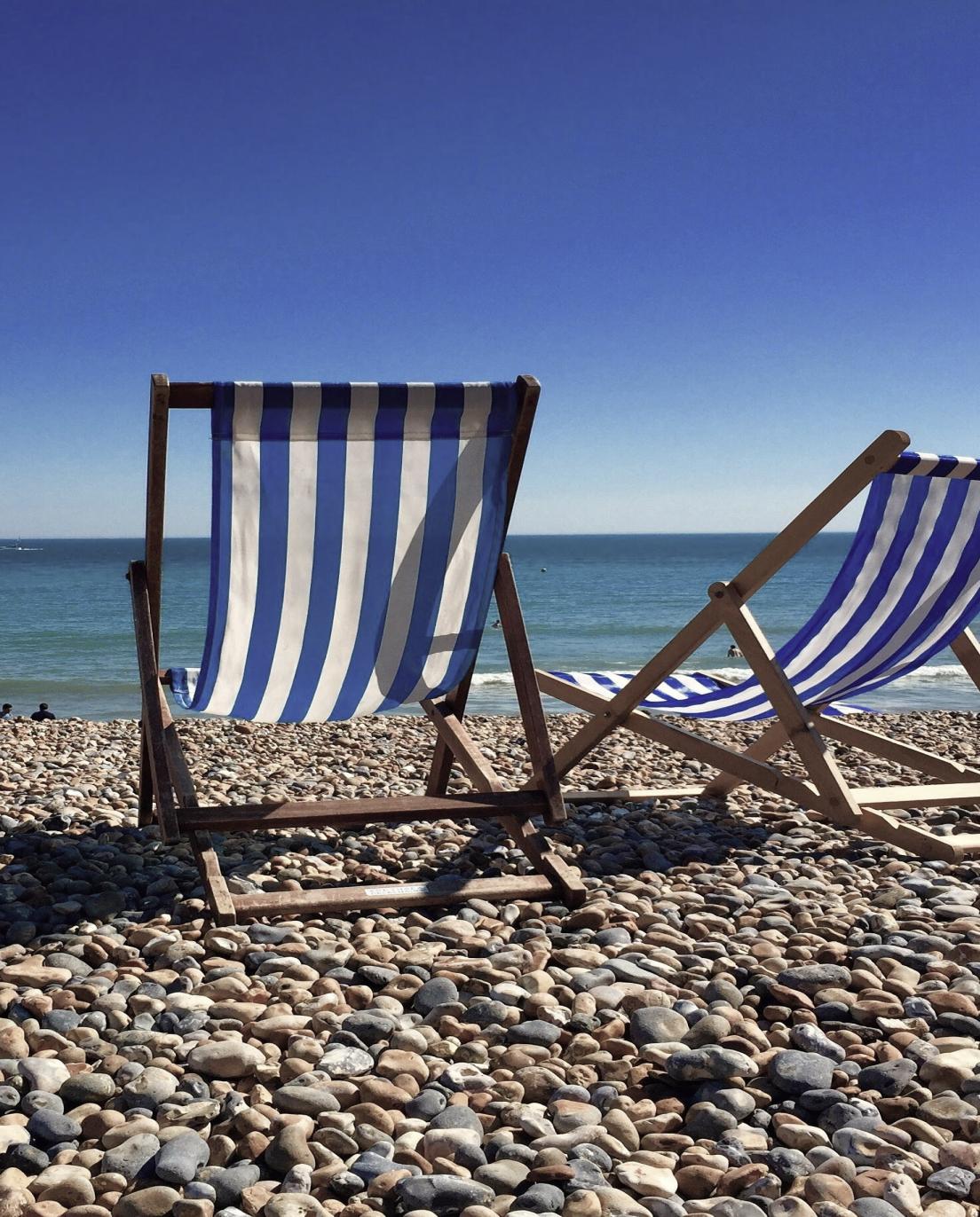 Deckchairs on a pebble beach
